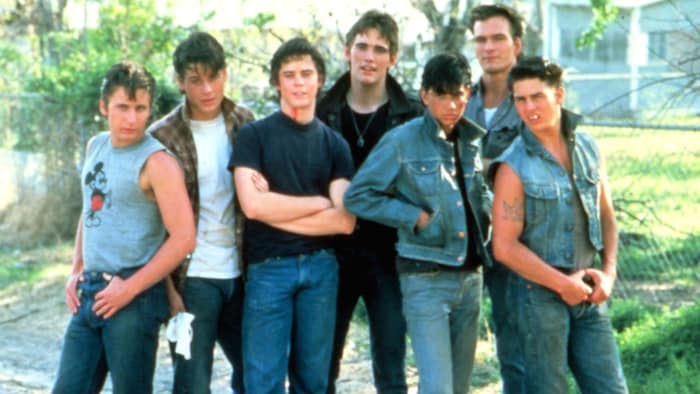Standing in front of the camera together for "The Outsiders": Rob Lowe (2nd from left) and Tom ...