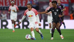 Xavi Simons (links) und Kingsley Coman spielen in den Transfer-Auseinandersetzungen zwischen Bayern und PSG eine wesentliche Rolle.  (Bild: AFP/APA/Ronny HARTMANN)