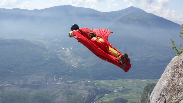 A base jumper with a wingsuit