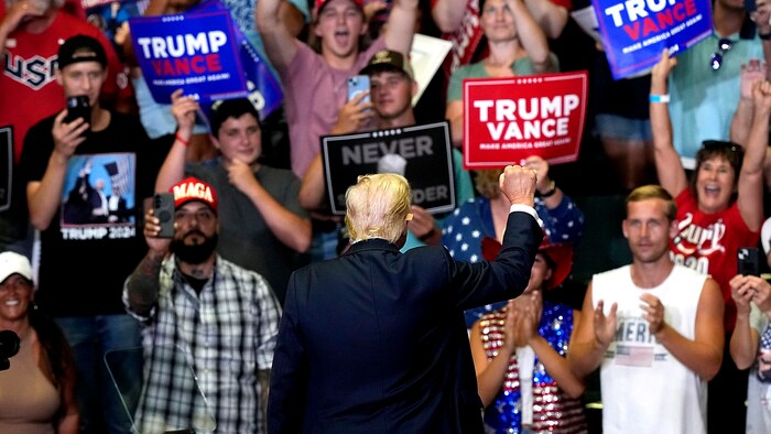 Trump's supporters - some wearing T-shirts with pictures of the shot former US president - cheered on their favorite.