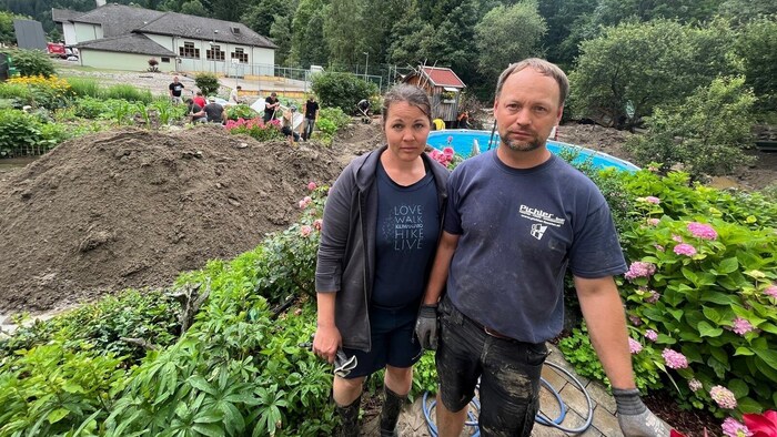 Katharina and Mario Zeppusch in front of the devastated garden.