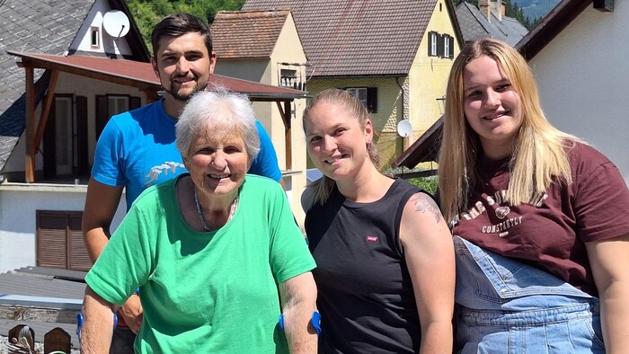 A smile, just for the photo. . . The senior citizen with Fiona F., her partner and sister