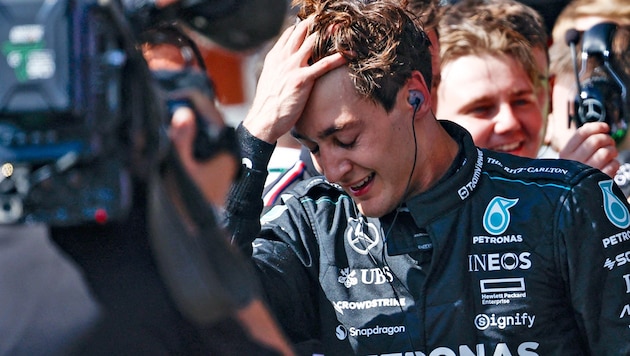 To tear your hair out: George Russell was too happy about his victory in Belgium. (Bild: APA/AFP/SIMON WOHLFAHRT)