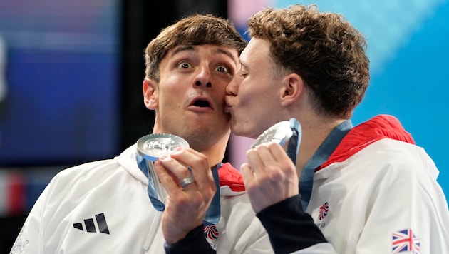 Thomas Daley (links) holte mit Noah Williams am Montag die Silbermedaille. (Bild: AP ( via APA) Austria Presse Agentur/ASSOCIATED PRESS)