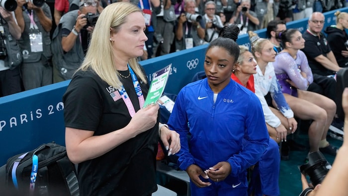 Biles (right) was not amused after her performance on the beam.