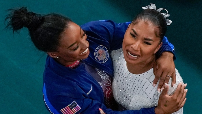 Simone Biles (left) celebrates with her colleague Jordan Chiles, who is crying with happiness