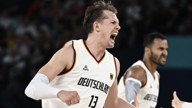 Jubilation among the German basketball players. (Bild: AFP)