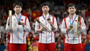 Wang Chuqin, Ma Long und Fan Zhendong