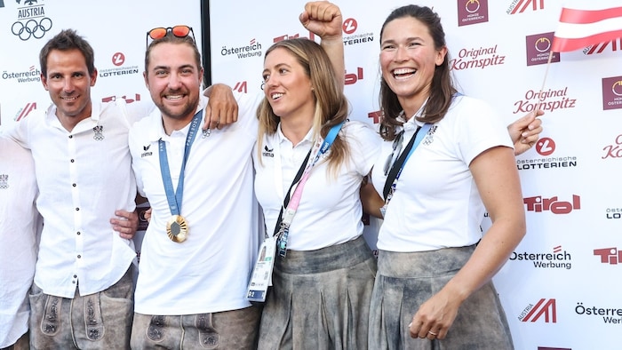 Lorena Abicht (far right) celebrated with her teammates at Austria House on Saturday evening.
