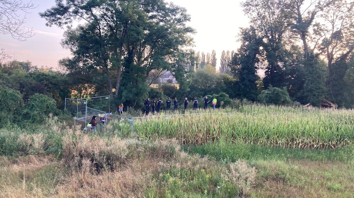 Police officers on the site of the protest camp.