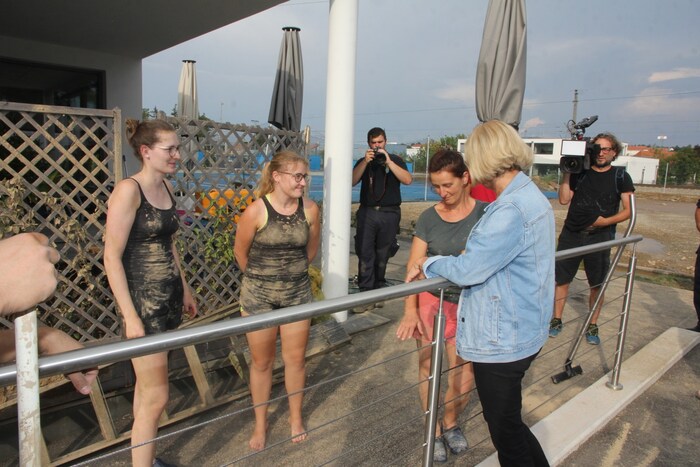 Young and old helped together, the governor offered comfort and promised financial aid.