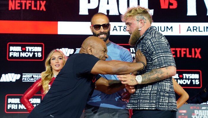 Mike Tyson (left) and Jake Paul clash before the fight.