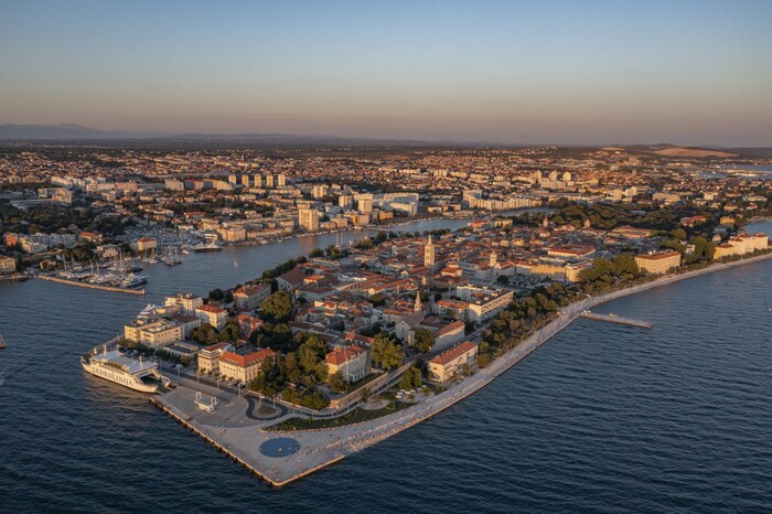 The old town with historic buildings and clear sea.