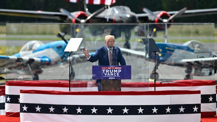 Donald Trump behind the protective glass 