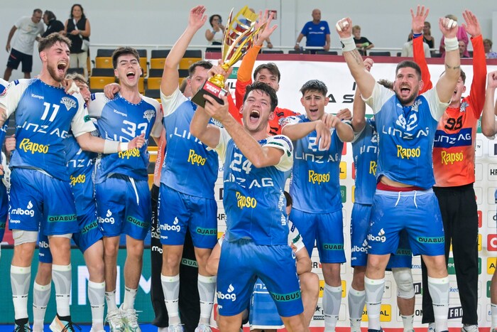 Neo-captain Moritz Bachmann lifts the Supercup trophy in the air.