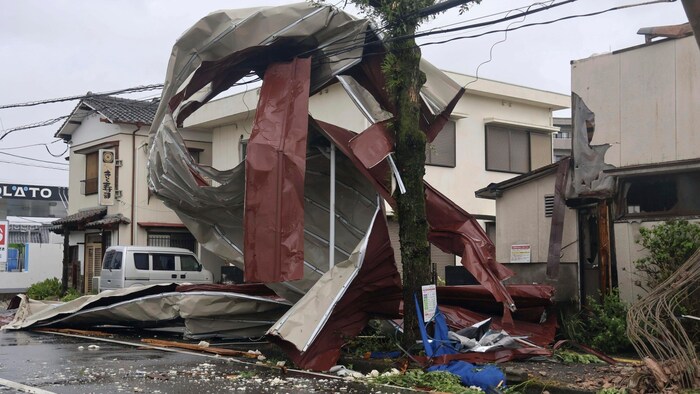 In Miyazaki, western Japan, a heavy metal object even got stuck in a power line due to the strong winds. 