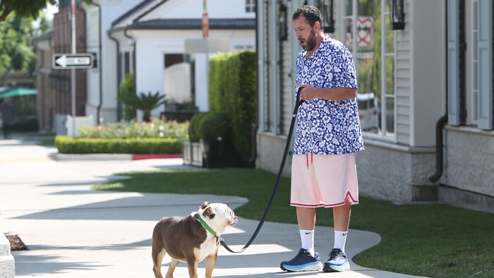 Adam Sandler, seen here walking the family dog, is the new style role model for Gen Z.