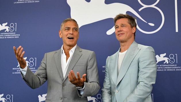 George Clooney and Brad Pitt at their press conference at the Venice Film Festival (Bild: APA Pool/AFP/Alberto PIZZOLI)