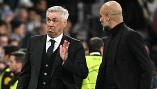 Carlo Ancelotti (links) und Pep Guardiola liefern sich hinter den Kulissen einen Kampf um Rodri.
