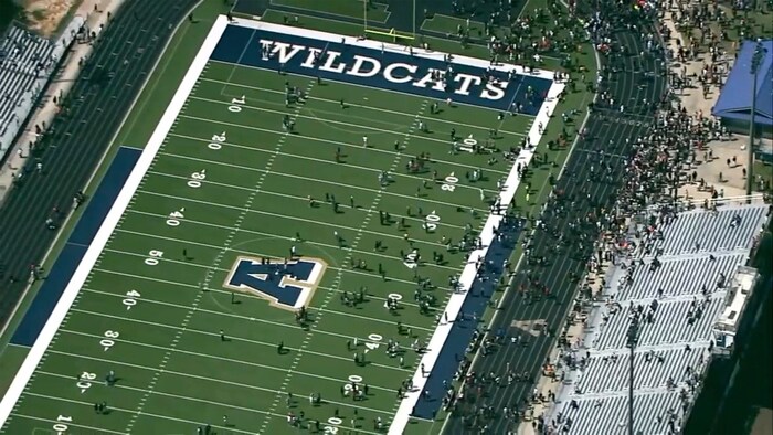 Students gathered on the school's football field and had already been evacuated from the buildings.