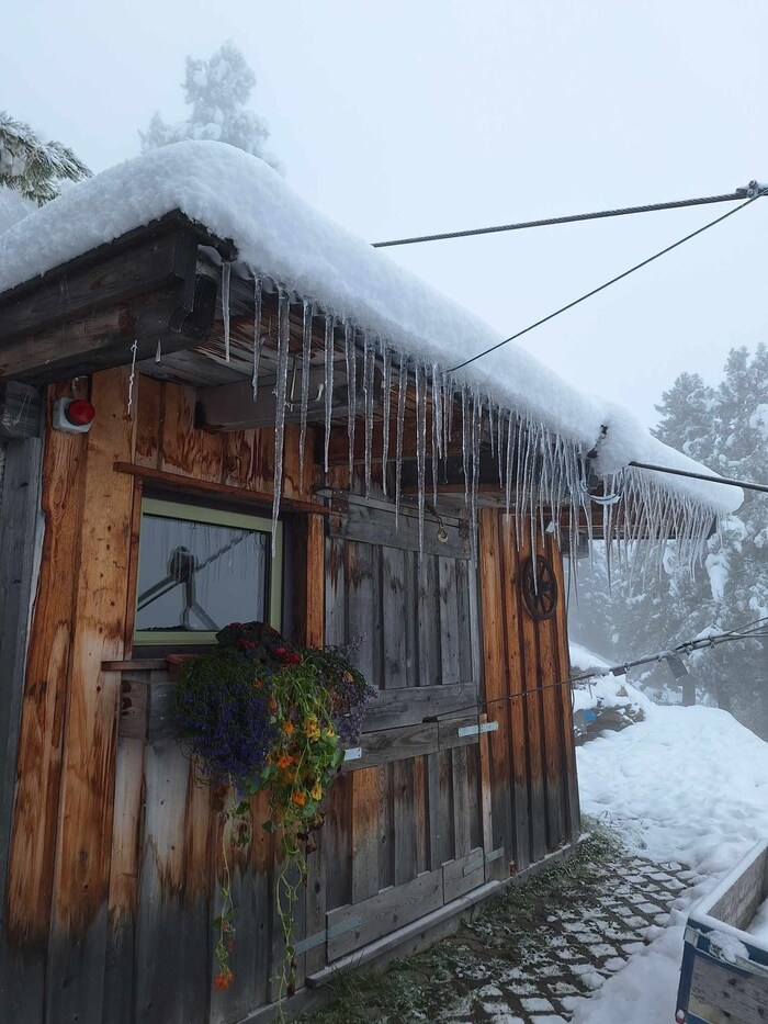 Icicles are already hanging from the roofs there.