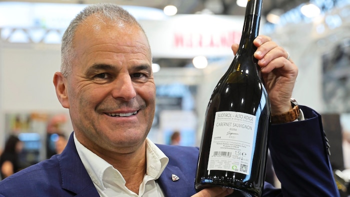 Dietmar Meraner with new QR codes on wine bottles, more of a nuisance.