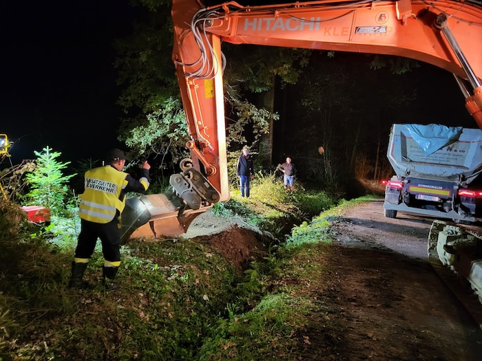 The soil was removed with an excavator and truck.