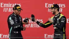 Auch Lewis Hamilton (links) hat sich an einen besonderen Moment mit Daniel Ricciardo erinnert.  (Bild: AFP/APA/POOL/Luca Bruno)