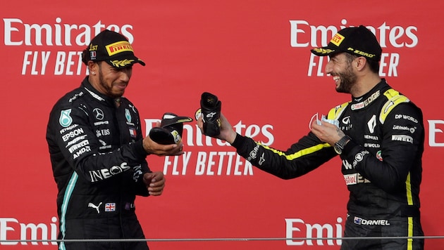 Auch Lewis Hamilton (links) hat sich an einen besonderen Moment mit Daniel Ricciardo erinnert.  (Bild: AFP/APA/POOL/Luca Bruno)