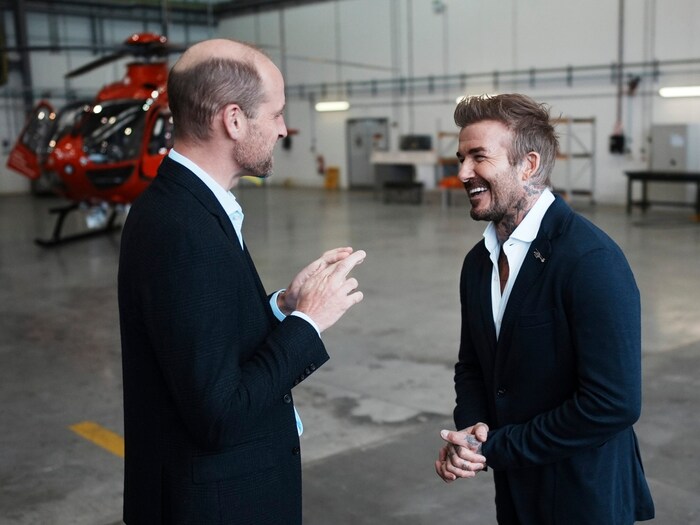 William und Beckham scherzen und lachen.