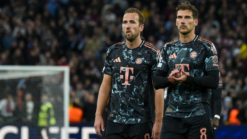 Harry Kane (l.) und Leon Goretzka mussten sich bei Aston Villa geschlagen geben. (Bild: AP ( via APA) Austria Presse Agentur/ASSOCIATED PRESS)