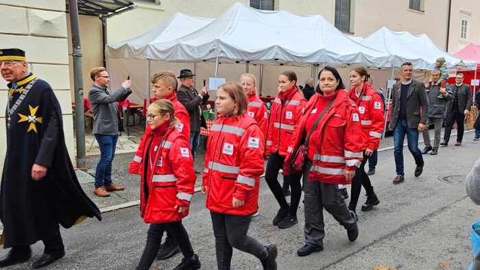 The Red Cross volunteers also marched along.