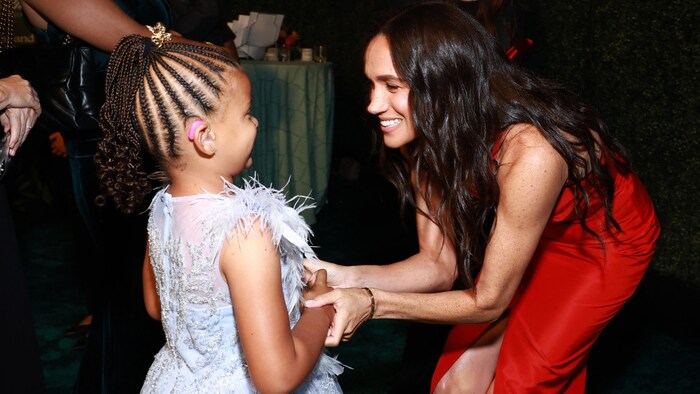 Duchess Meghan also took plenty of time for the younger visitors.