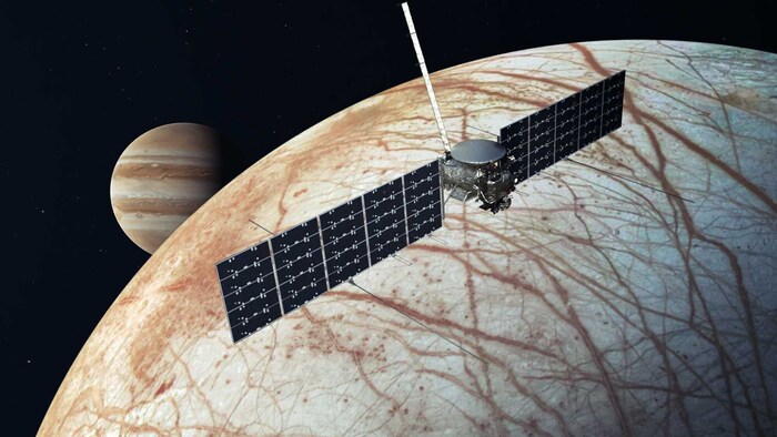 Scientists suspect an ocean of liquid water beneath the surface of the icy moon Europa (in the ...