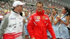 Ralf (l.) und Michael Schumacher (Bild: AFP/LIU JIN / AFP)