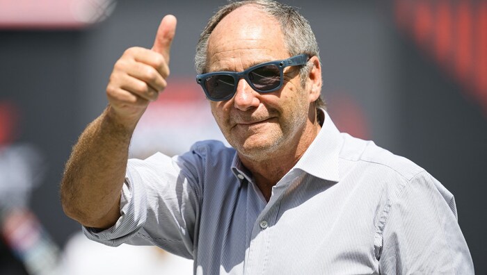 Gerhard Berger tips his hat.