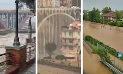 Wassermassen donnern bei Genua von einer Autobrücke in den darunterliegenden Fluss. Zahlreiche ...