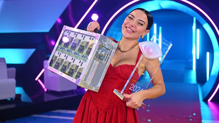 Leyla Lahouar with her suitcase of money