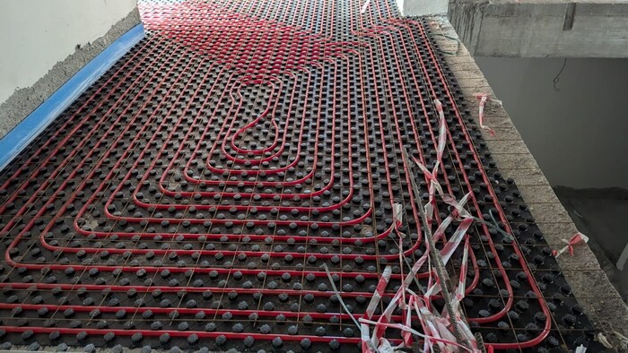 Underfloor heating is installed throughout the building.