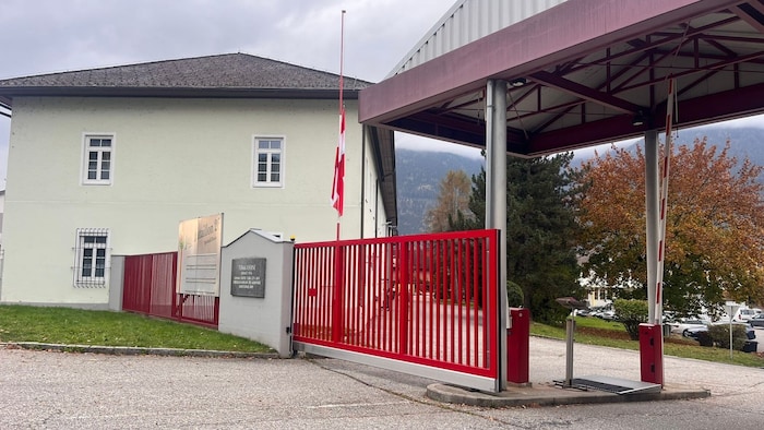 The Austrian flag of the Türk barracks flies at half-mast.