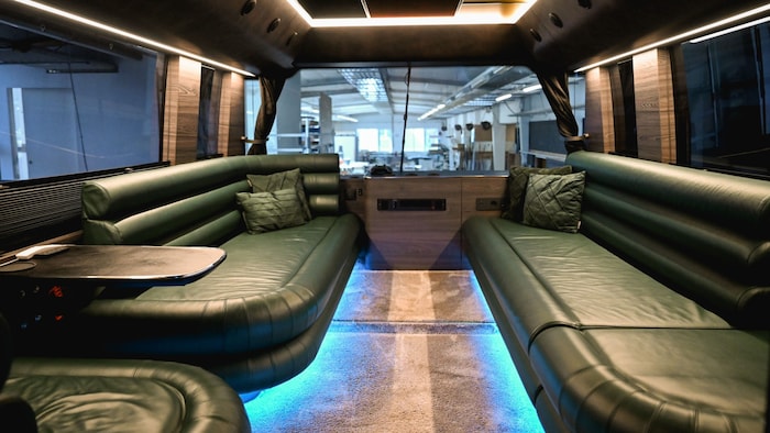 The lounge is set up above the chauffeur's seat.