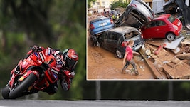 Schwere Unwetterschäden in Spanien: Francesco Bagnaia (re.) drohte mit Streik. (Bild: APA/AFP/Lillian SUWANRUMPHA, Associated Press)