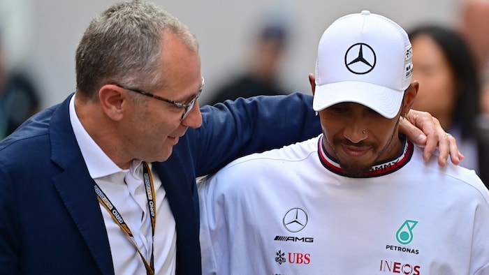 Stefano Domenicali (left) and Lewis Hamilton