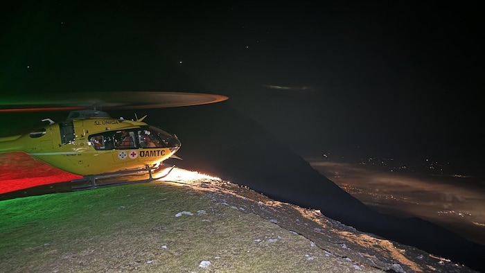 Heli start at the Langer Sattel into Innsbruck at night below.