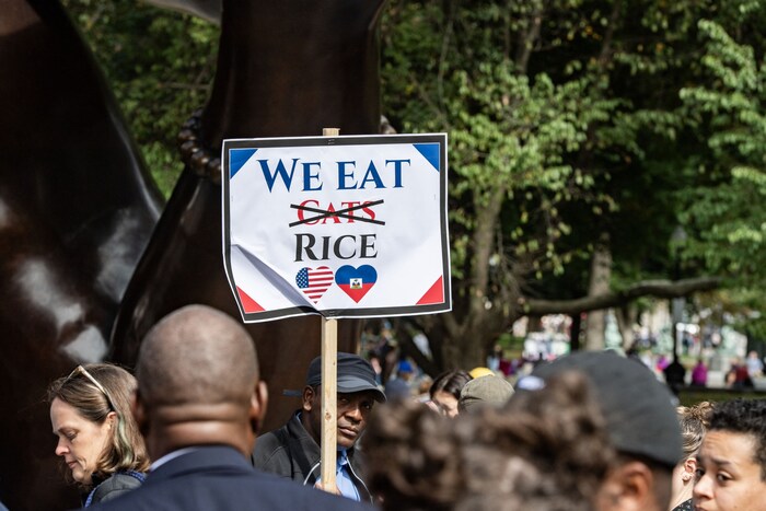 "We eat rice", reads one poster.