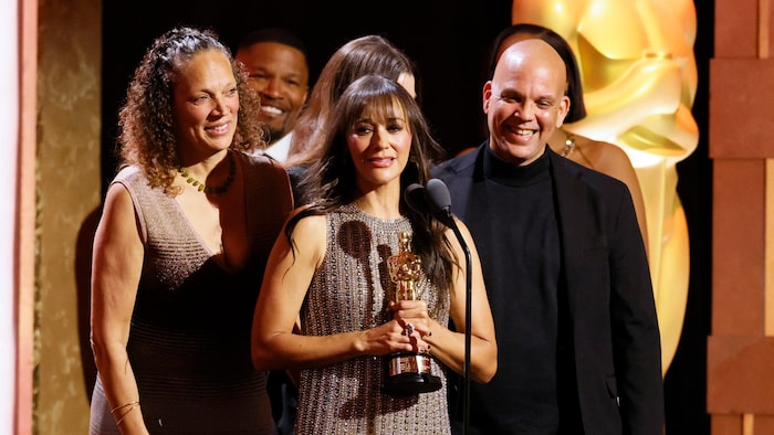 Rashida Jones, daughter of Quincy Jones, accepted the honorary Oscar on behalf of her recently ...