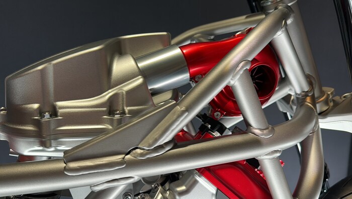 The electric compressor sits on top of the engine. Intercooling is not necessary.