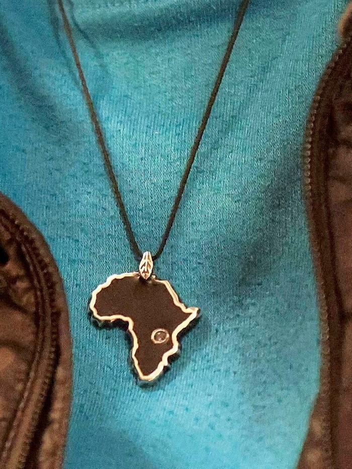 One pendant shows the African continent, the gemstone Tanzania.