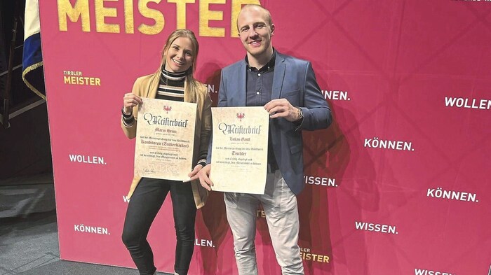 Lukas and girlfriend Maria with their championship certificates.