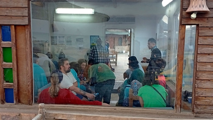 Survivors recover from the ordeal in a café shortly after the tragedy.